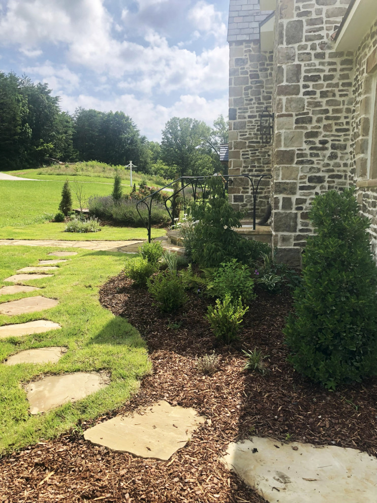 Inspiration for a small traditional full sun front yard landscaping in Other.