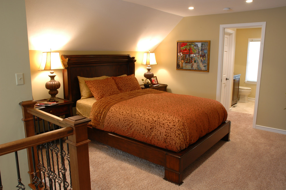 This is an example of a mid-sized contemporary master bedroom in Minneapolis with yellow walls, carpet and brown floor.