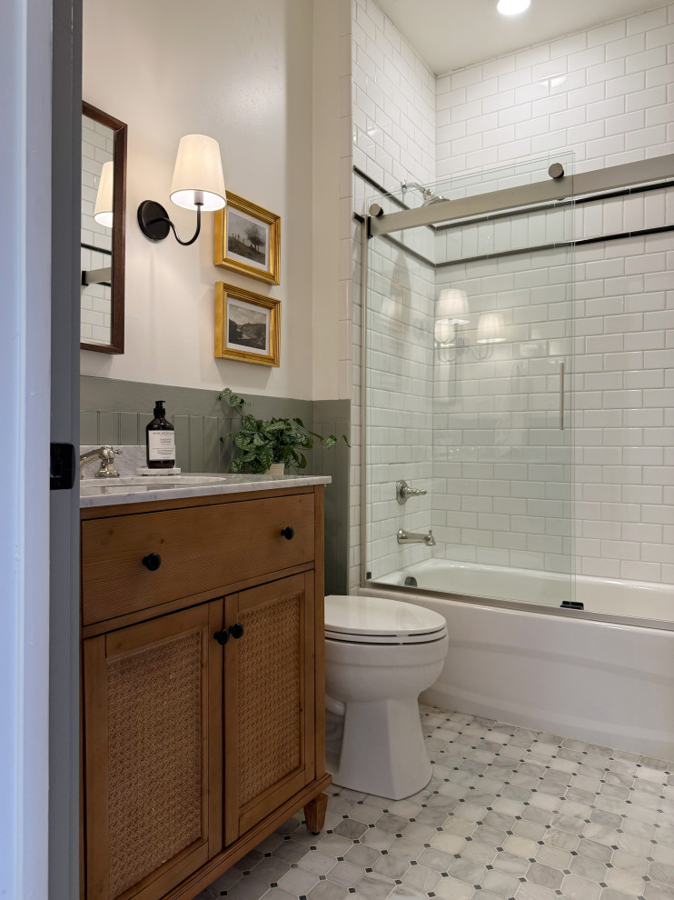 Mountain style white tile and subway tile gray floor, single-sink and wainscoting bathroom photo in Nashville with recessed-panel cabinets, medium tone wood cabinets, white walls, an undermount sink, white countertops and a freestanding vanity