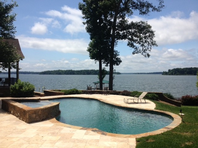 Inspiration for a rustic pool remodel in Charlotte
