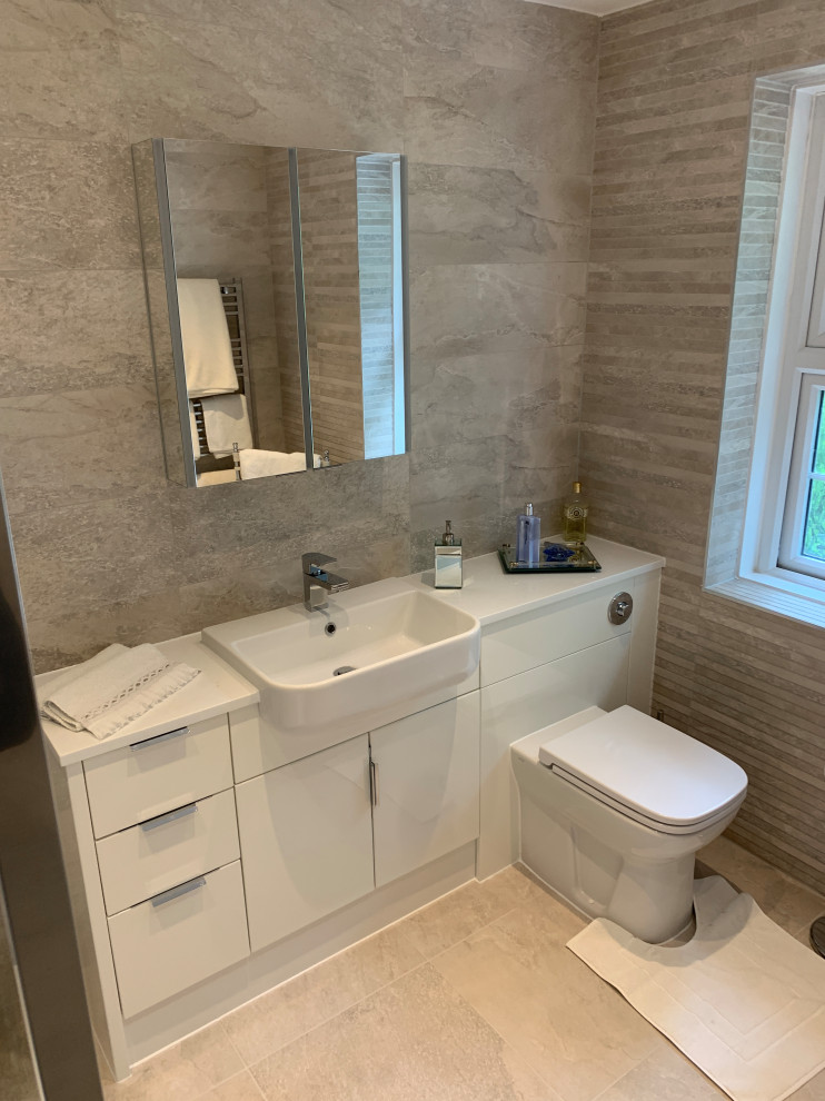 Inspiration for a contemporary cloakroom in Hertfordshire with white cabinets, white worktops and a built in vanity unit.