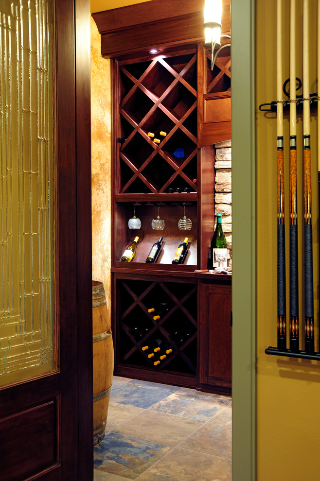 Inspiration for a mid-sized traditional wine cellar in Seattle with slate floors and diamond bins.