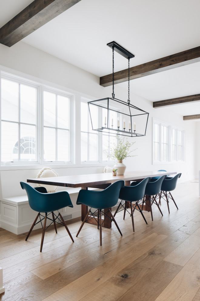 Dining Room - Inspiration for a coastal light wood floor and exposed beam kitchen/dining room combo remodel in Grand Rapids with white walls and no fireplace