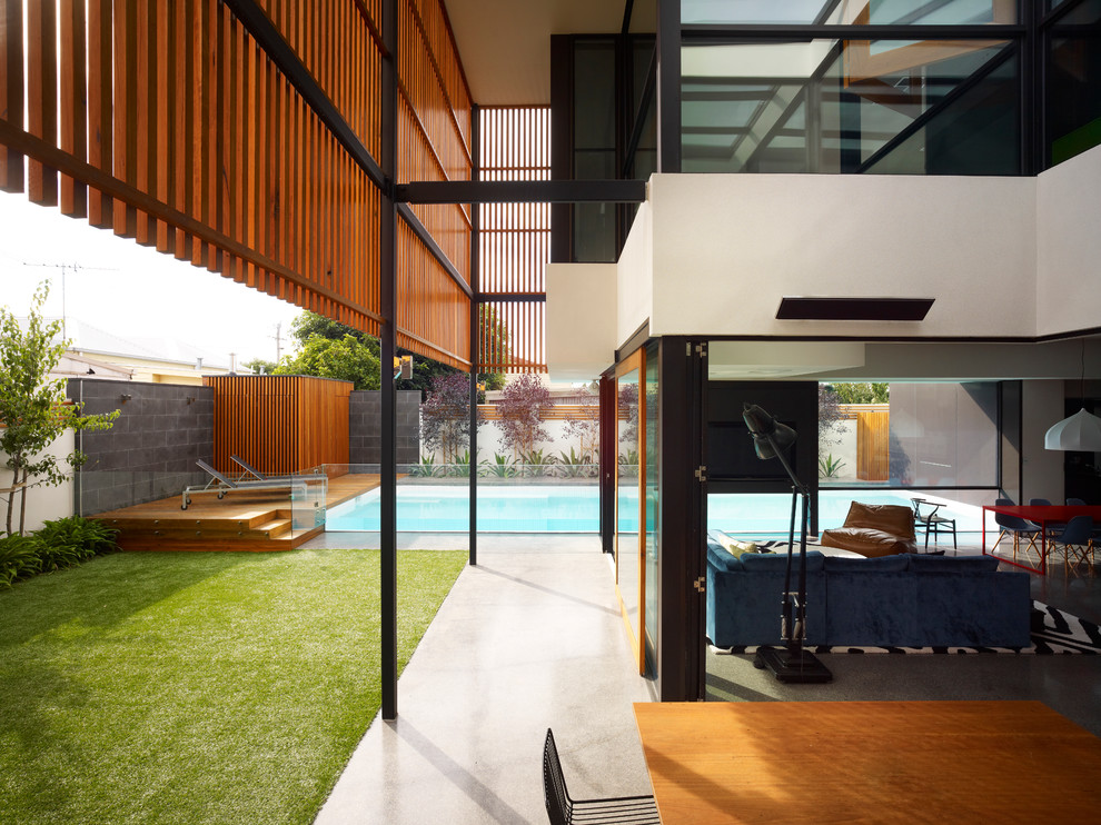 Inspiration for a contemporary two-storey exterior in Melbourne.