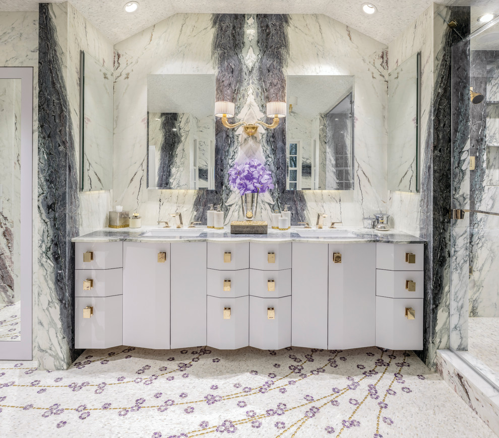 Photo of an eclectic master bathroom in New York with glass-front cabinets, stone slab, multi-coloured walls, marble floors, a console sink, multi-coloured floor and a hinged shower door.