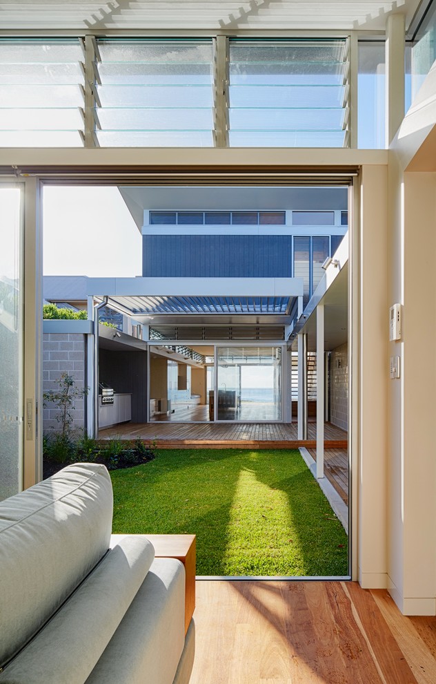 Photo of a contemporary patio in Sydney with decking and a pergola.