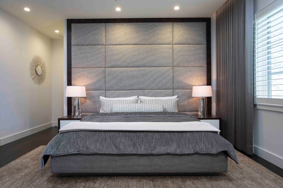 Large modern master bedroom in Orlando with dark hardwood floors.