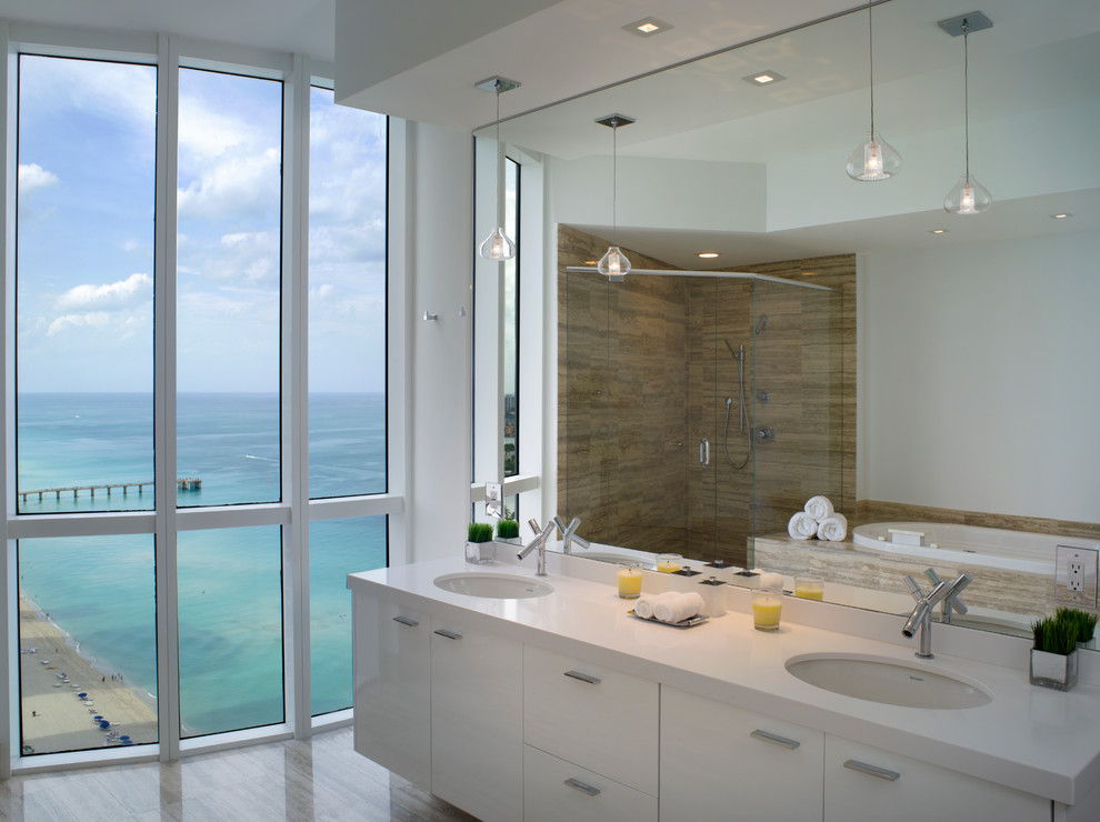 Photo of a modern bathroom in Miami with an undermount sink, flat-panel cabinets, white cabinets, brown tile and white benchtops.