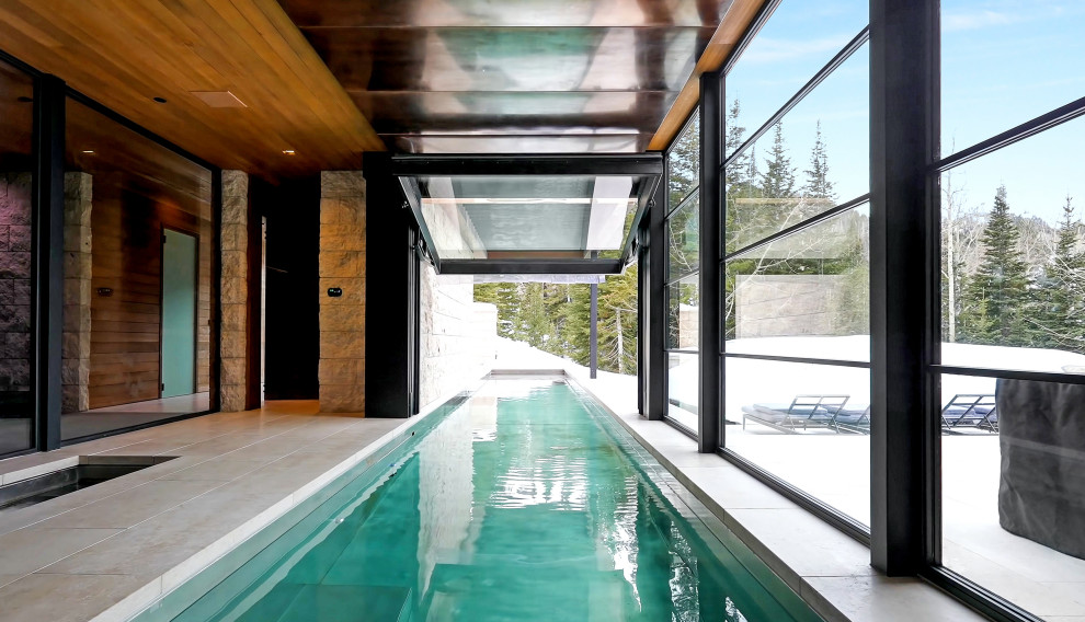 Geräumiger Moderner Pool in rechteckiger Form mit Natursteinplatten in Salt Lake City