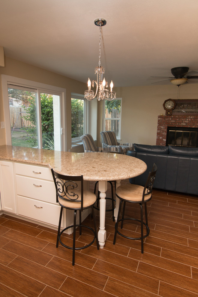 Example of a mid-sized transitional u-shaped porcelain tile open concept kitchen design with an undermount sink, recessed-panel cabinets, beige cabinets, quartz countertops, beige backsplash, mosaic tile backsplash and colored appliances
