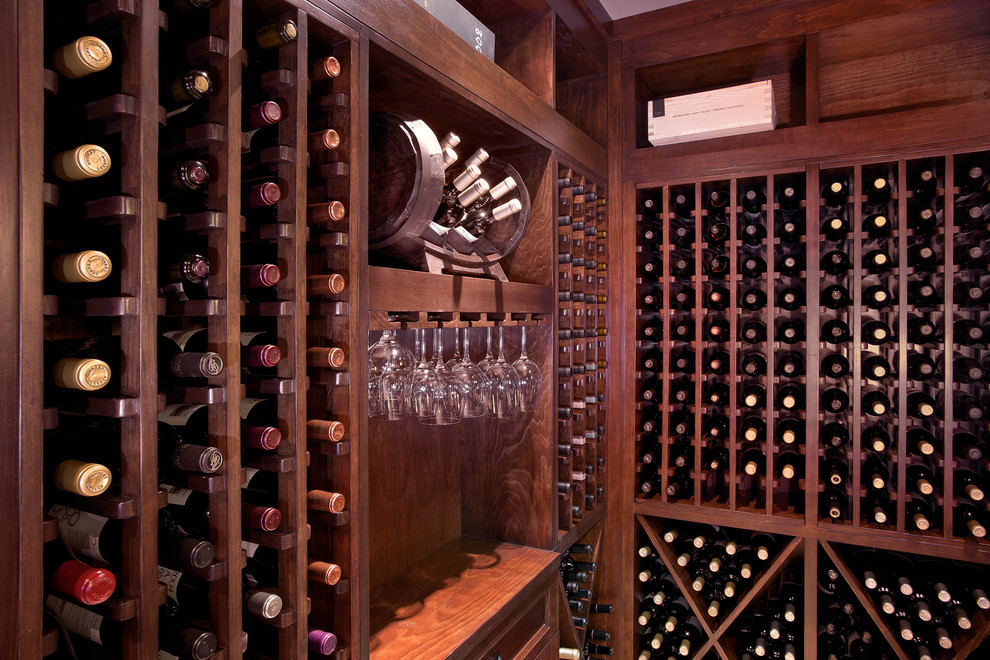 Inspiration for a mid-sized midcentury wine cellar in Chicago with storage racks.