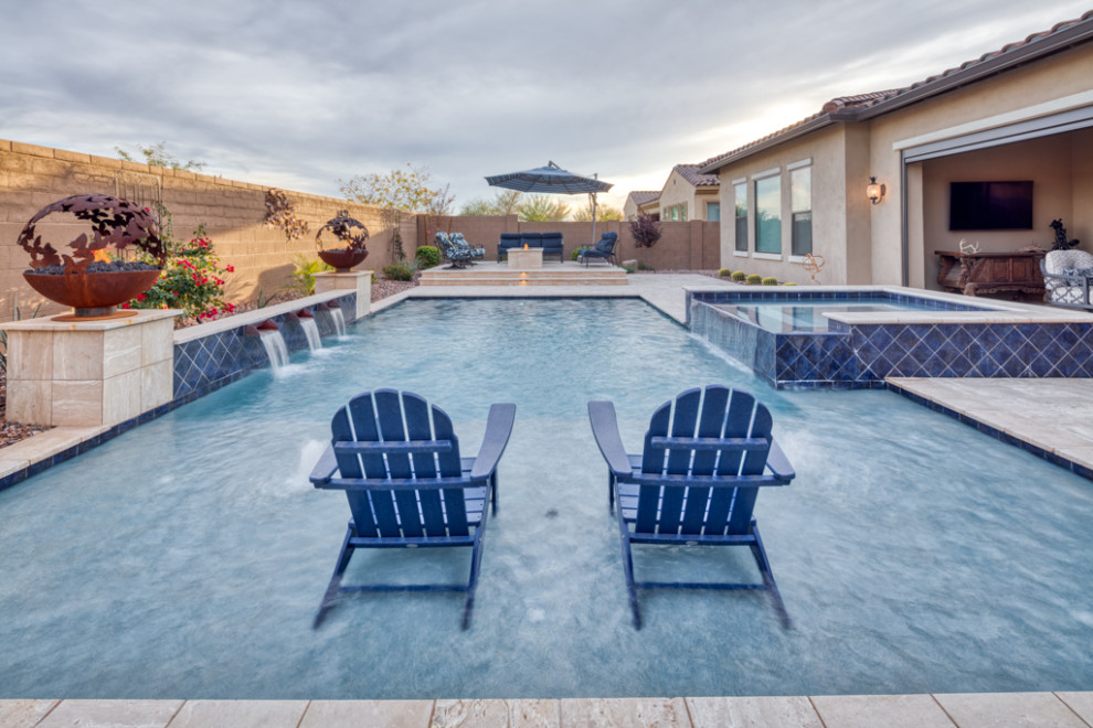 Large trendy backyard concrete paver and rectangular natural pool landscaping photo in Phoenix