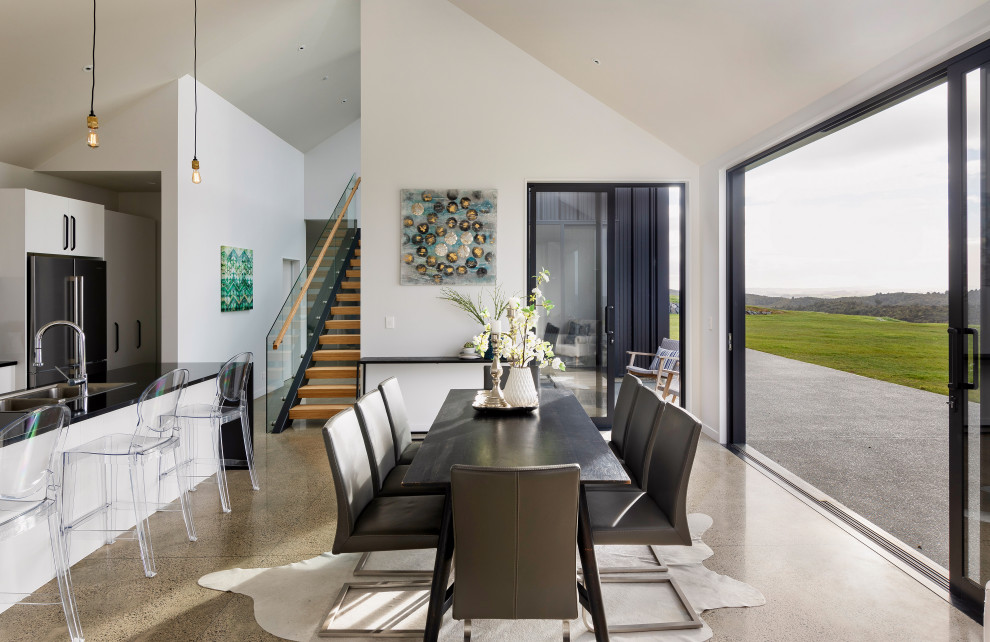 Photo of a contemporary dining room in Auckland.