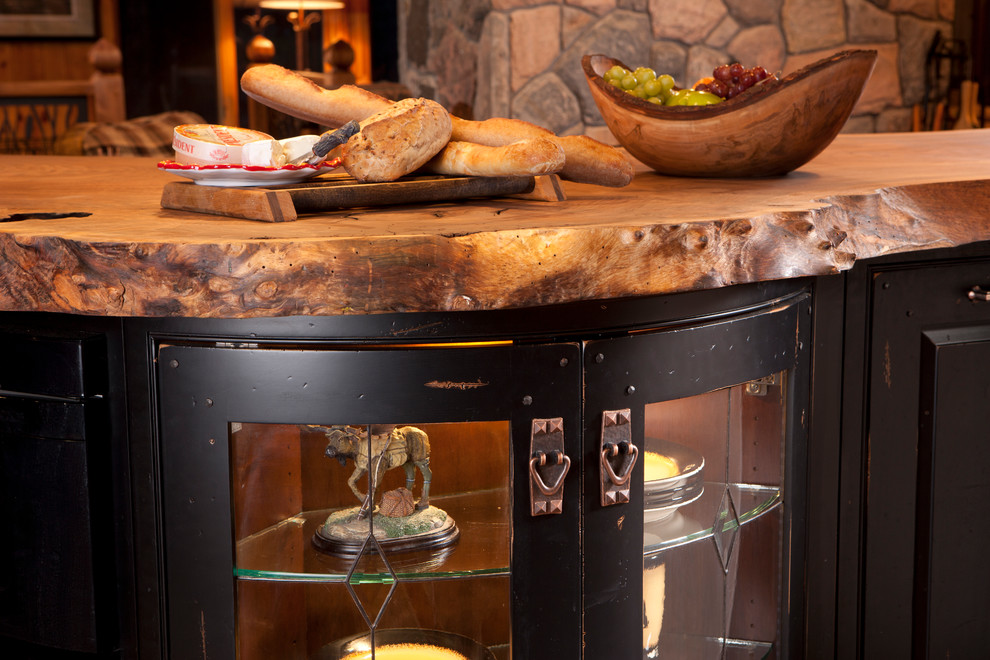Mid-sized mountain style u-shaped medium tone wood floor home design photo in Toronto with raised-panel cabinets, distressed cabinets, granite countertops, paneled appliances and an island