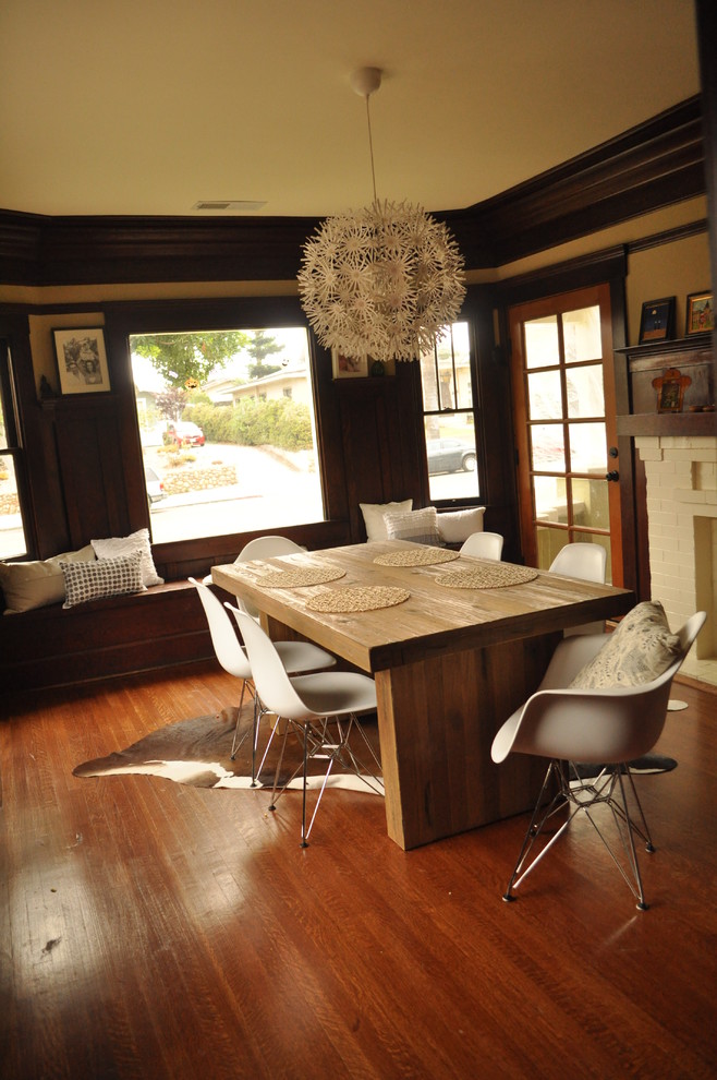 Design ideas for a transitional dining room in San Diego with beige walls and dark hardwood floors.