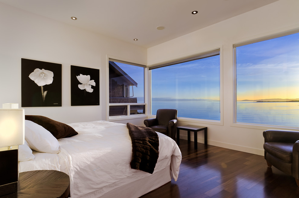 Inspiration for a contemporary bedroom in Vancouver with white walls and dark hardwood floors.