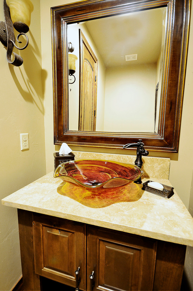 Example of a transitional home design design in Denver