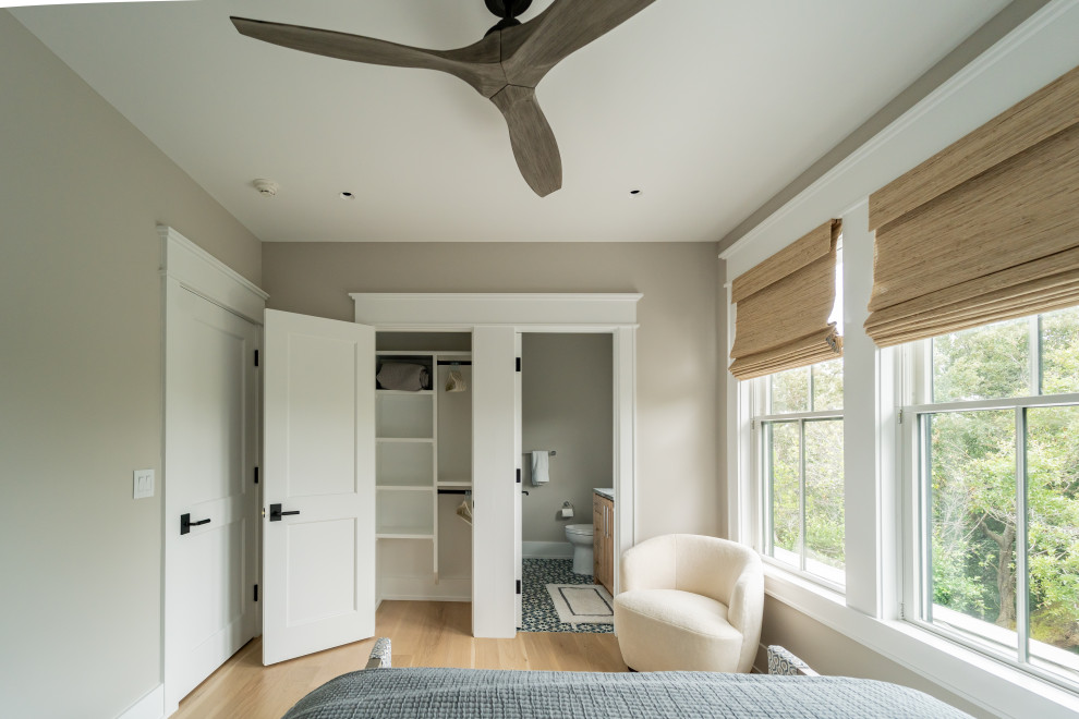 Bedroom - coastal guest bedroom idea in Other with beige walls