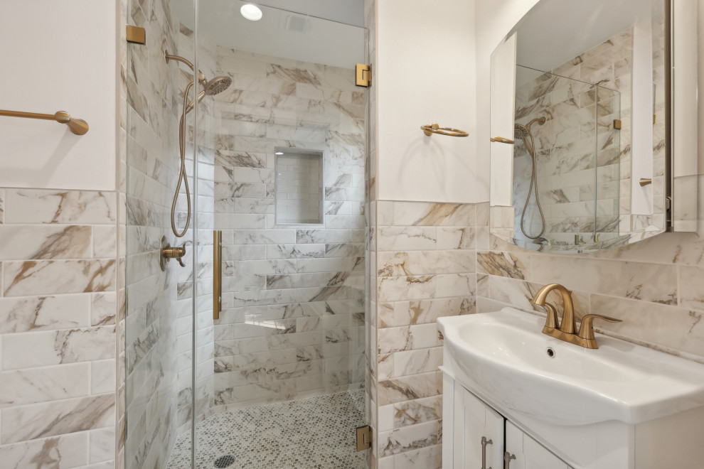 Bathroom with Marble Tile and Gold Fixtures