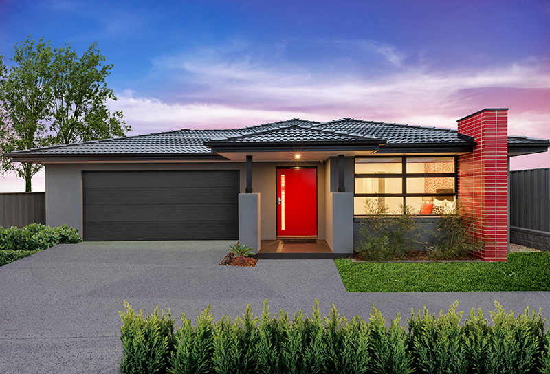 Design ideas for a mid-sized contemporary one-storey brick grey exterior in Sydney.