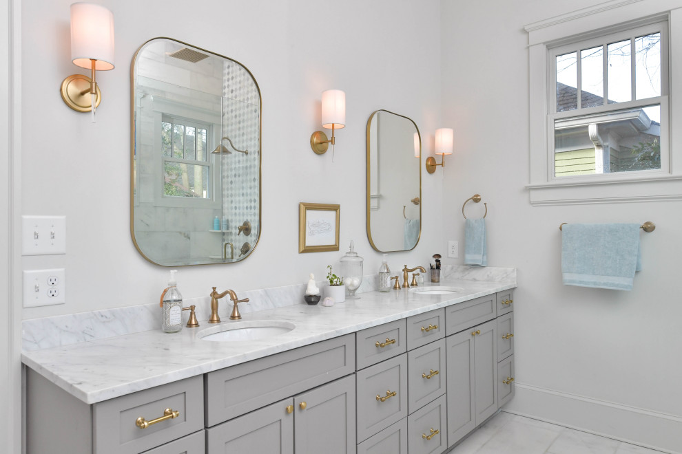 Design ideas for a large transitional master bathroom in Atlanta with shaker cabinets, grey cabinets, a freestanding tub, a corner shower, white tile, marble, white walls, marble floors, an undermount sink, marble benchtops, white floor, a hinged shower door, multi-coloured benchtops, a double vanity and a built-in vanity.