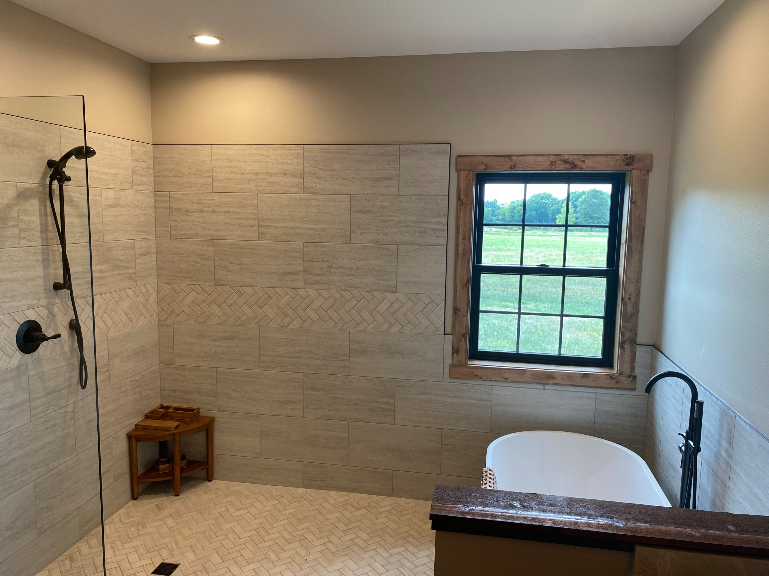 Master bath wet room with partial glass wall