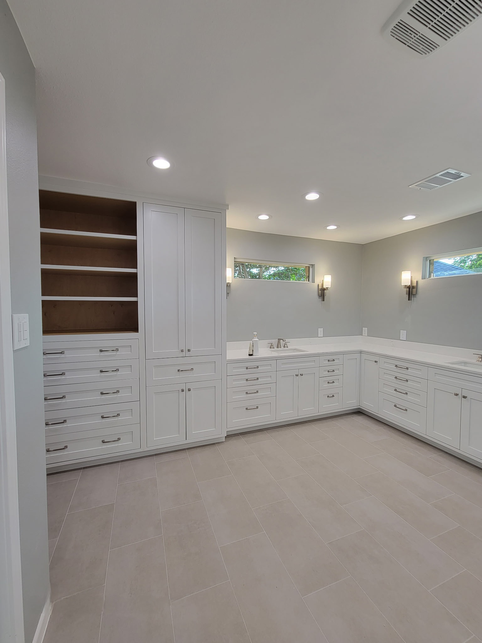 Two separate bathrooms converted into a master bathroom with a big open closet
