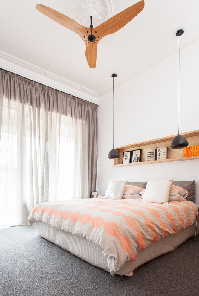This is an example of a mid-sized contemporary bedroom in Melbourne with white walls, carpet and no fireplace.