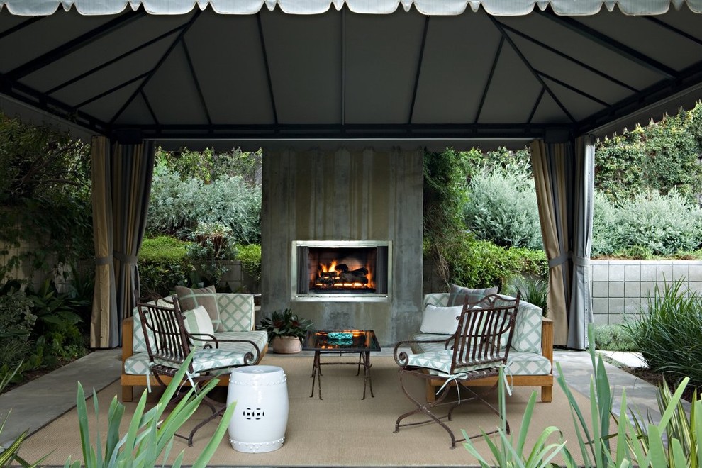 Transitional patio in Los Angeles with a fire feature.