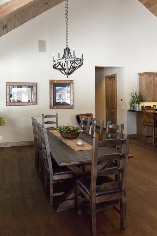 Inspiration for a large rustic medium tone wood floor and brown floor great room remodel in Phoenix with beige walls and no fireplace