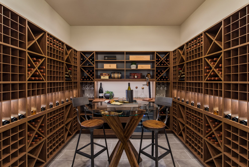 This is an example of a mid-sized modern wine cellar in Portland with grey floor.