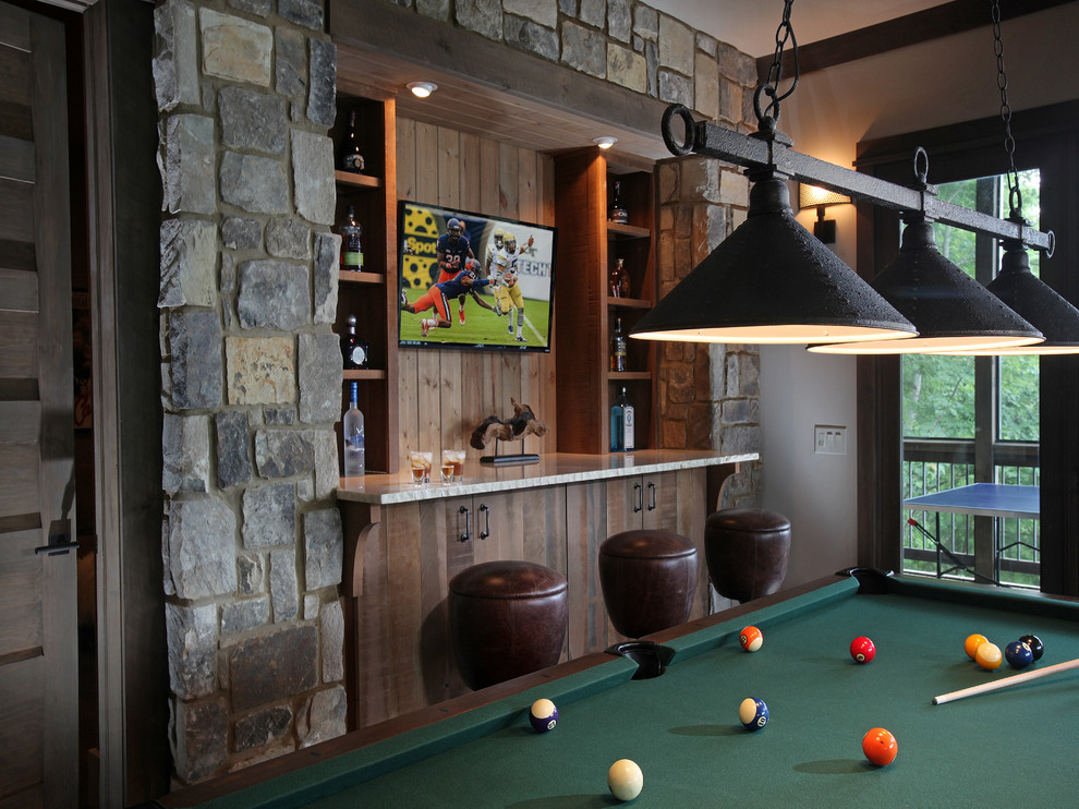 Inspiration for a mid-sized country look-out basement in Atlanta with grey walls.