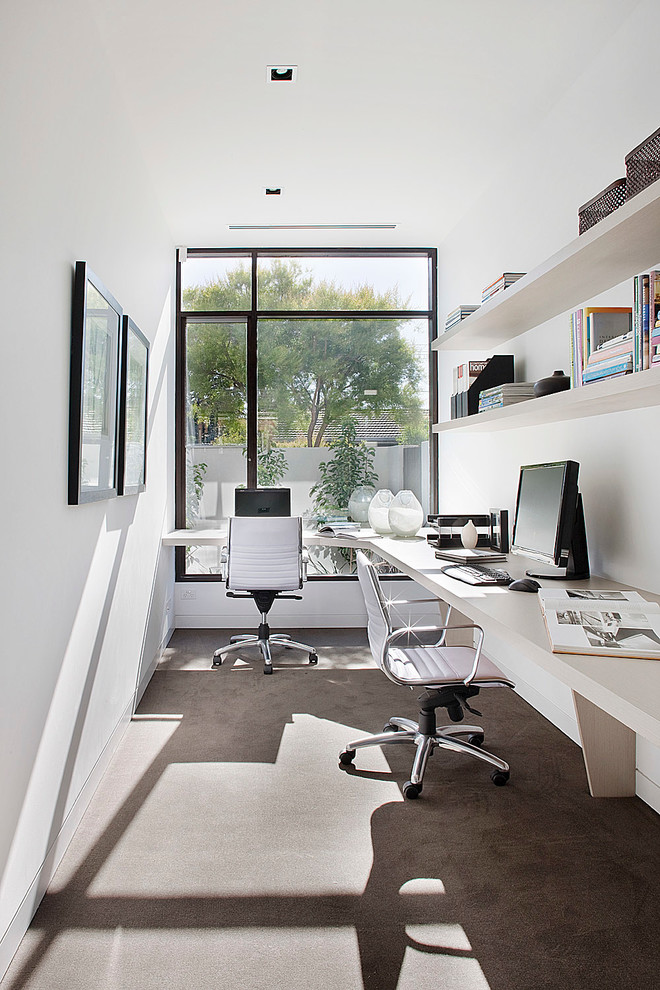 Design ideas for a contemporary study room in Melbourne with white walls, concrete floors, no fireplace and a built-in desk.