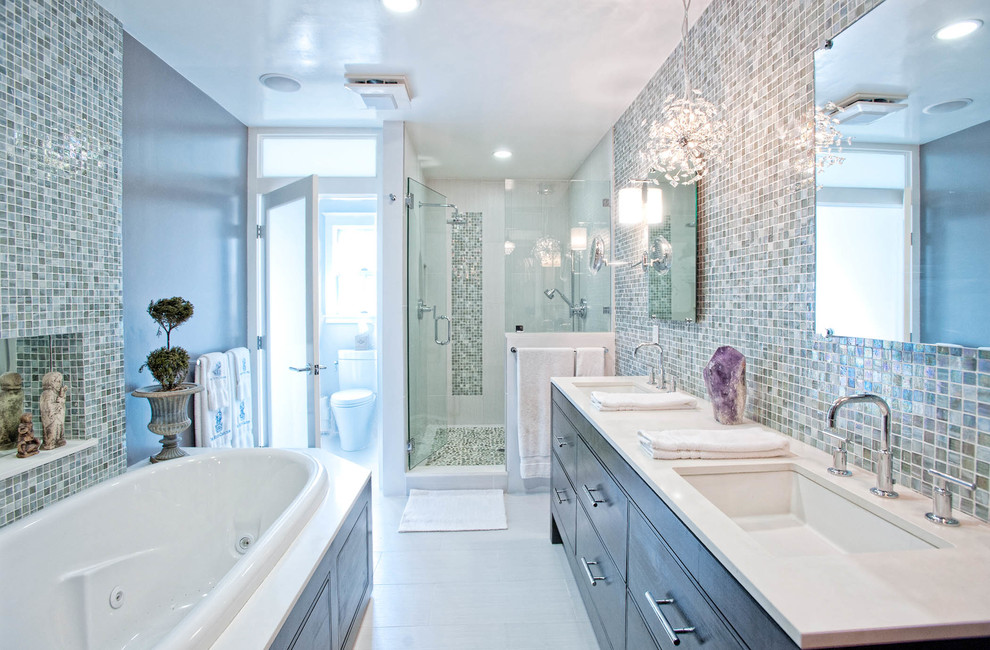 Traditional bathroom in Los Angeles with an undermount sink, flat-panel cabinets, dark wood cabinets, a drop-in tub, an alcove shower, a one-piece toilet, multi-coloured tile, mosaic tile and an enclosed toilet.