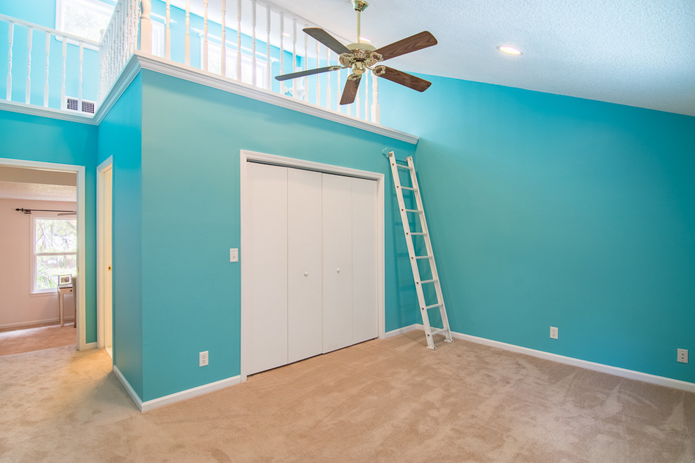 Contemporary gender-neutral kids' bedroom in Jacksonville with carpet.