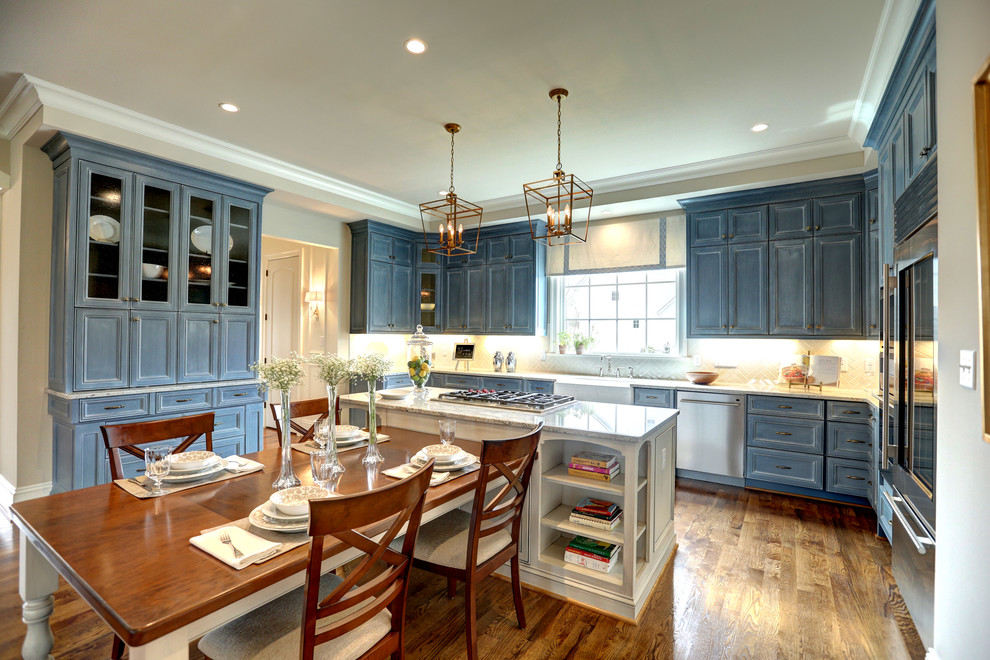 Traditional eat-in kitchen in Richmond with a farmhouse sink, recessed-panel cabinets, distressed cabinets, stainless steel appliances and with island.