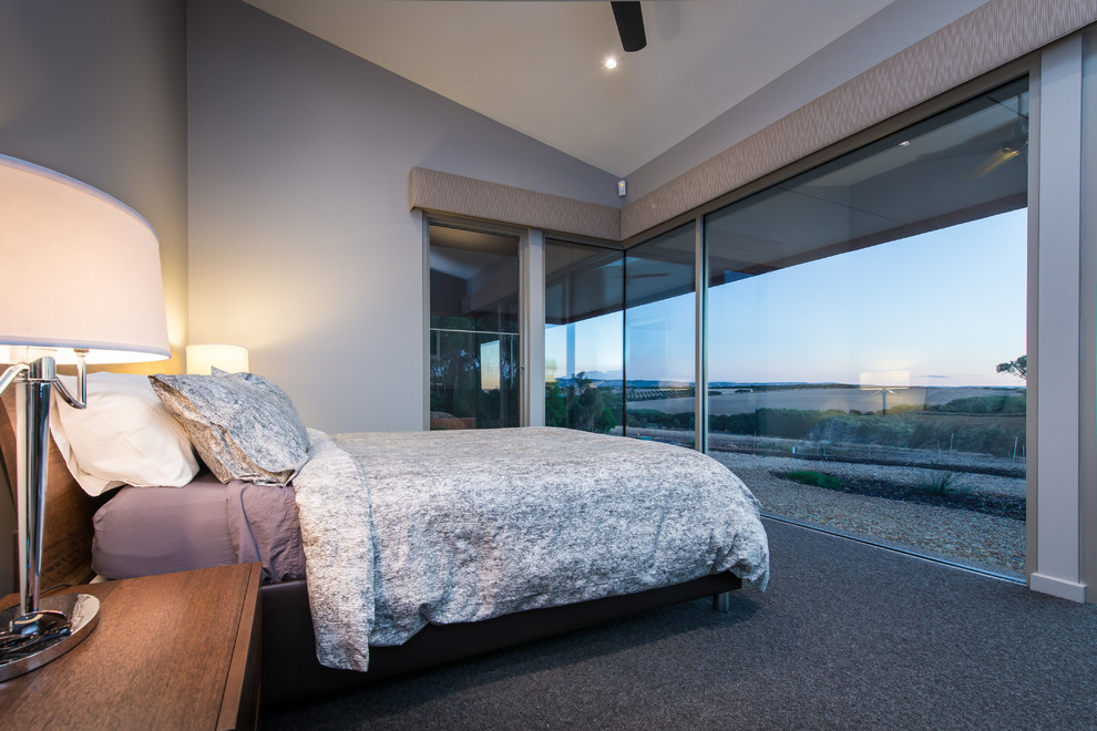 Photo of a contemporary bedroom in Adelaide with grey walls, carpet and no fireplace.
