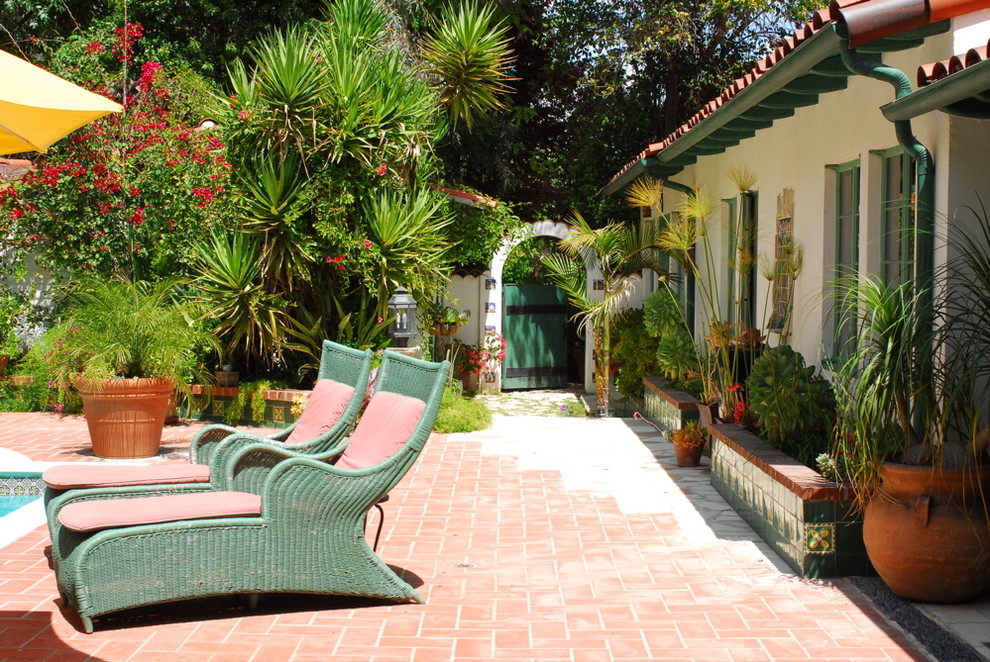 Mediterranean patio in Los Angeles with brick pavers.