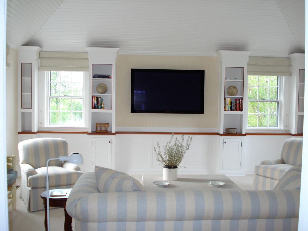 This is an example of a beach style home theatre in Boston.