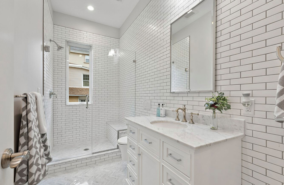 Inspiration for a mid-sized transitional master white tile and subway tile marble floor bathroom remodel with shaker cabinets, white cabinets, marble countertops and white countertops