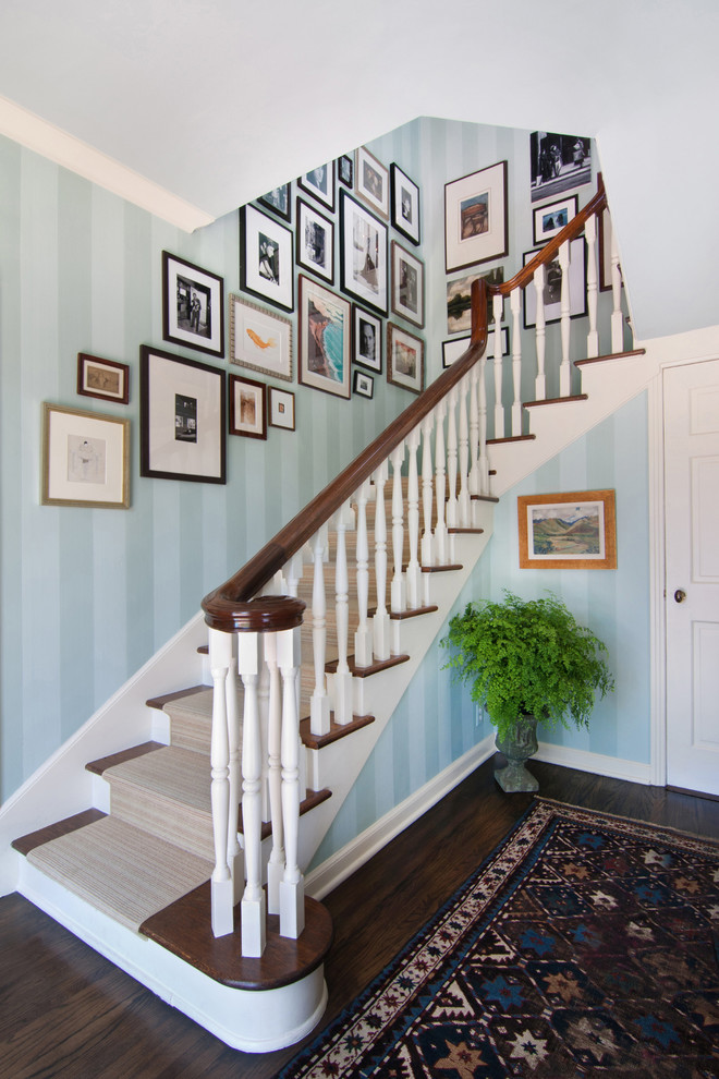 Photo of a mid-sized transitional wood l-shaped staircase in Los Angeles with painted wood risers.