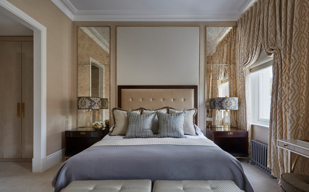Inspiration for a traditional bedroom in London with beige walls, carpet and no fireplace.
