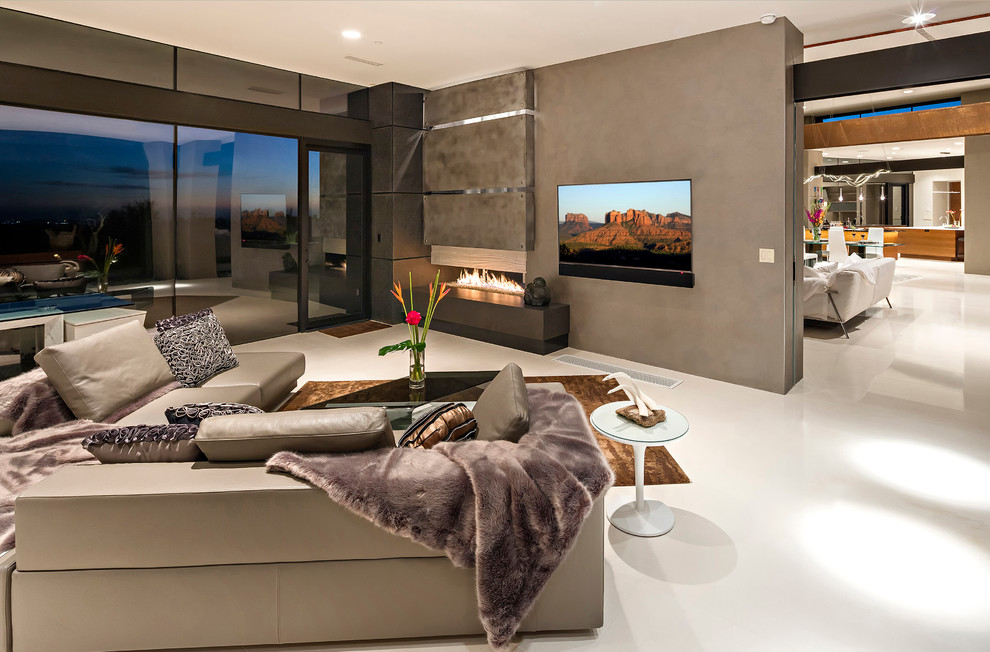 This is an example of a mid-sized modern open concept family room in Phoenix with beige walls, porcelain floors, a ribbon fireplace and a wood fireplace surround.