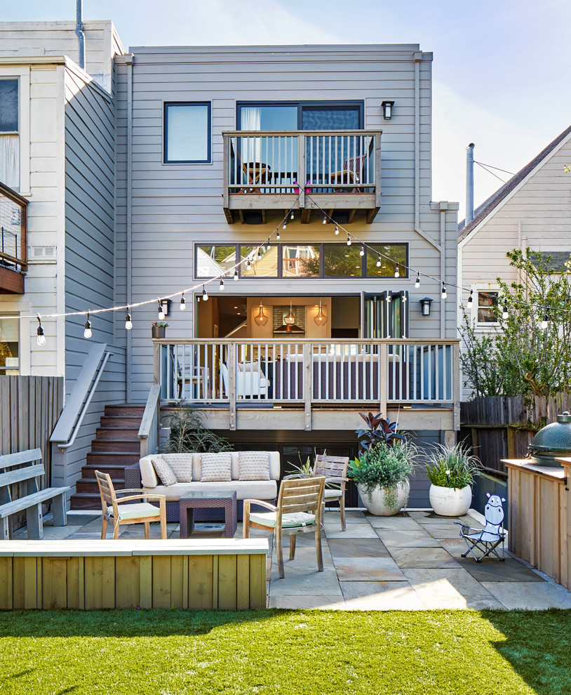 Example of a transitional gray three-story exterior home design in San Francisco