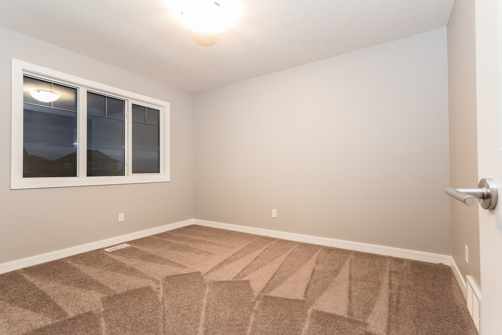 Transitional home design photo in Edmonton