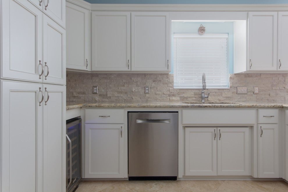 Example of a large transitional galley eat-in kitchen design in Miami with flat-panel cabinets and white cabinets