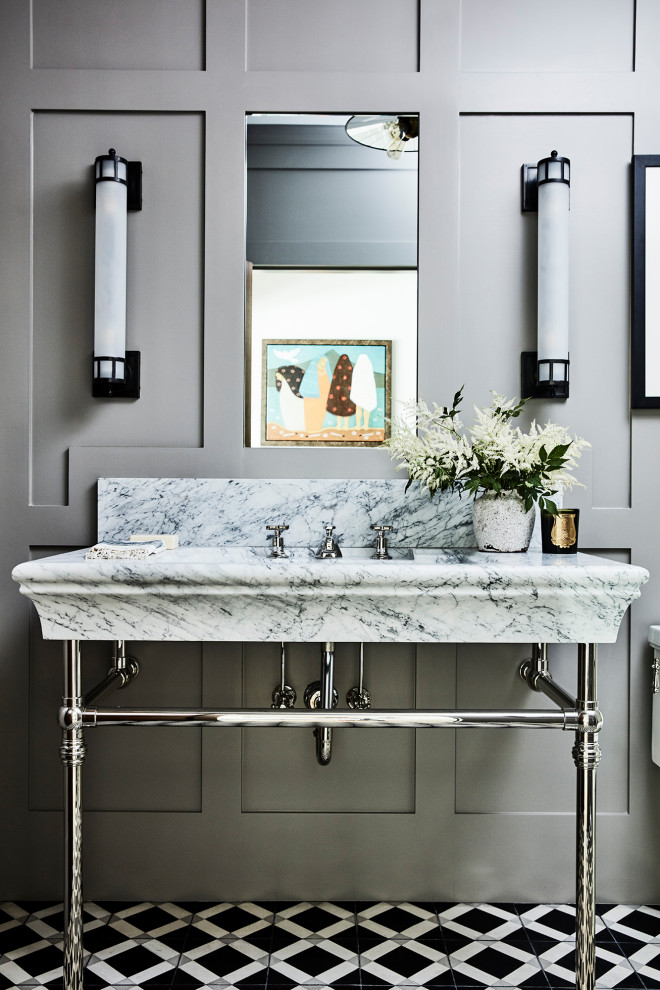 Design ideas for a country powder room in Los Angeles with grey walls, marble floors, a pedestal sink, marble benchtops, a freestanding vanity and panelled walls.