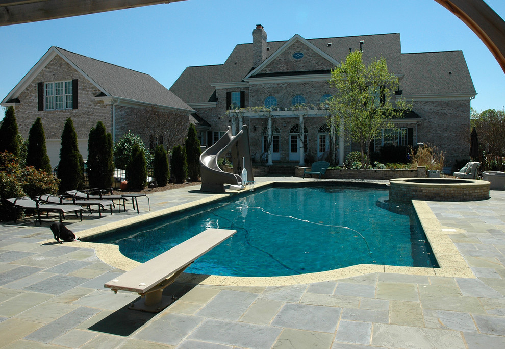 Example of a transitional home design design in Charlotte