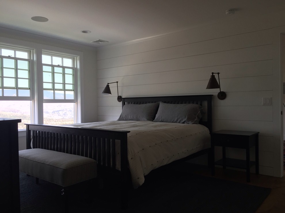 Design ideas for a mid-sized country master bedroom in Burlington with white walls, dark hardwood floors and a standard fireplace.