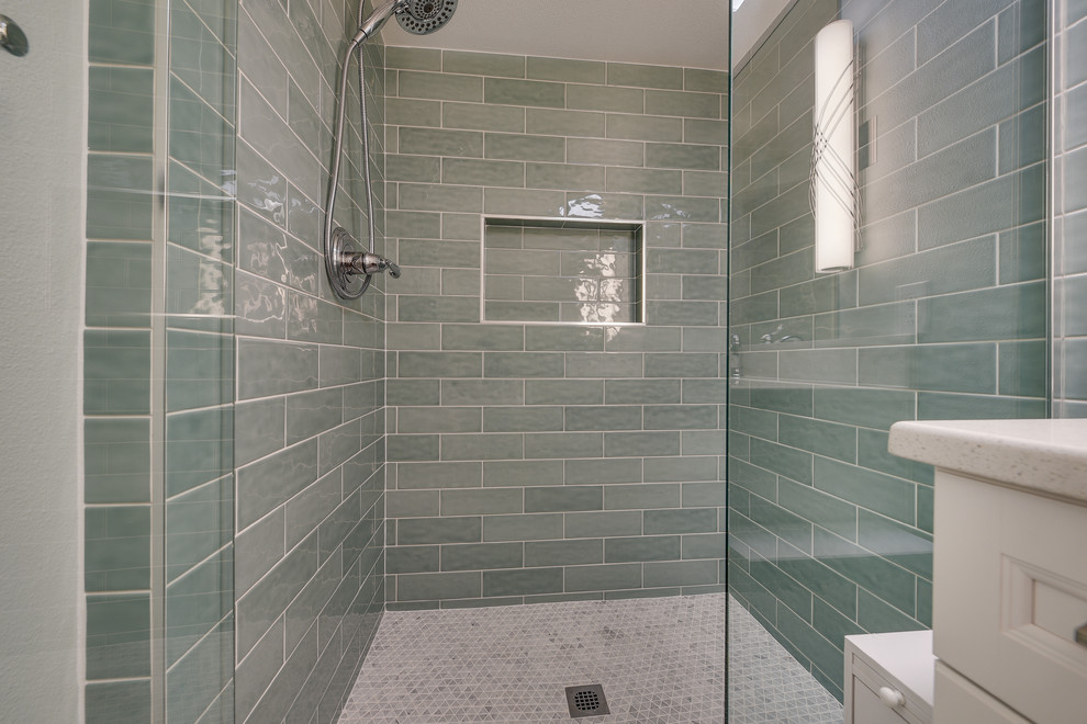 Design ideas for a mid-sized transitional kids bathroom in Portland with raised-panel cabinets, white cabinets, an alcove shower, a two-piece toilet, blue tile, subway tile, blue walls, porcelain floors, an undermount sink, engineered quartz benchtops, brown floor, a hinged shower door and white benchtops.